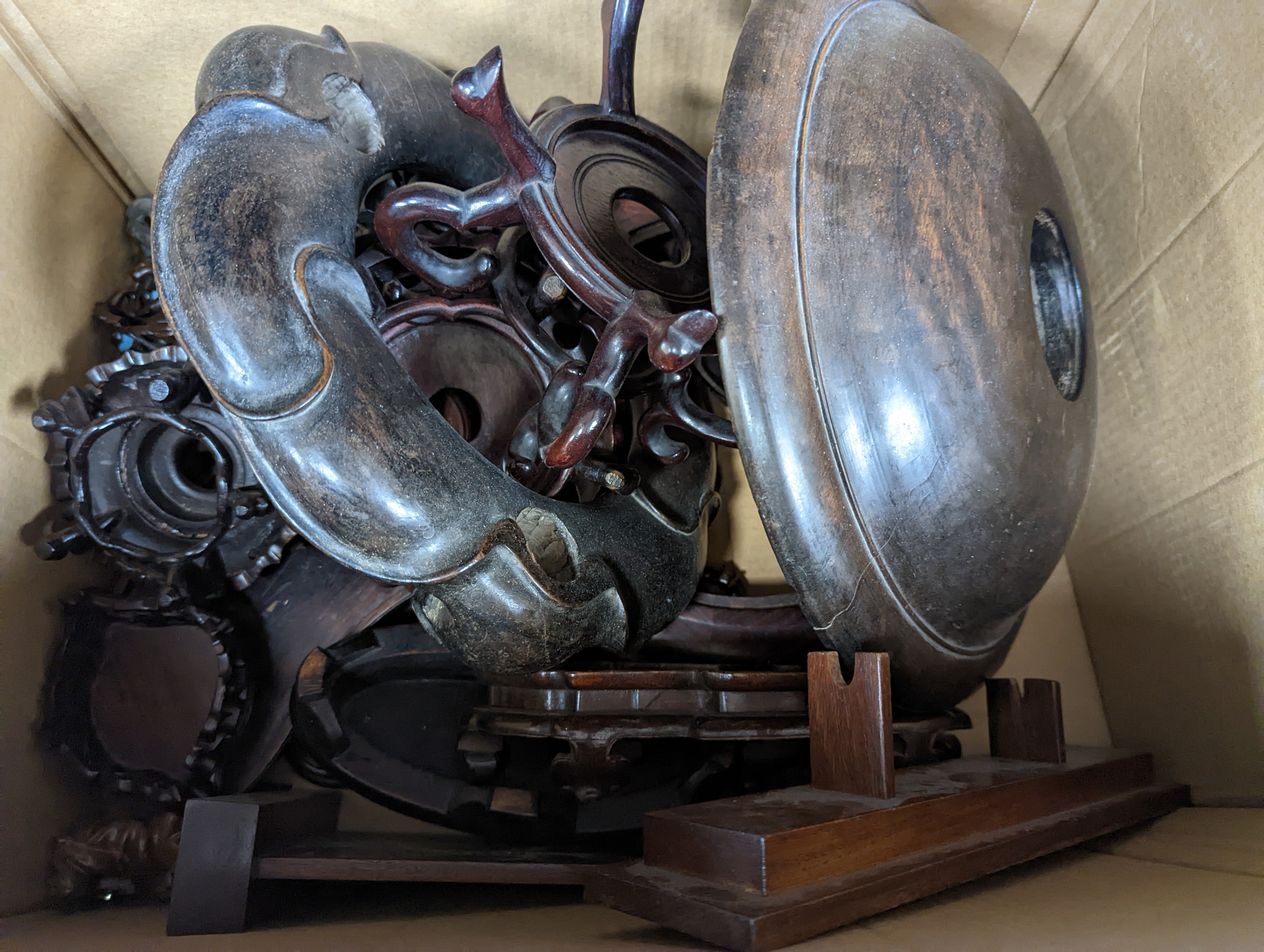 A quantity of Oriental carved wood stands